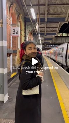 a woman standing in front of a train at a station with the words how much did you spend on your trip?