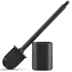 a black brush and container on a white background