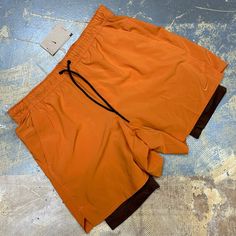 I’m Selling A Brand New With Tags Pair Of Nike Unlimited 7” Versatile Dri-Fit Men’s 2 In 1 Compression Lined Running Shorts In Orange With Brown Compression Shorts And An Embroidered Nike Check! Features Drawstring, Compression Shorts Lining And Side Pockets. Adult Xl Width Measures 18 Inches Hip To Hip Length Measures 17.5 Inches Hip To Leg Opening Inseam Measures 7 Inches Nike Id Dv9334-815 Msrp $70 Click Add To Bundlebelow To Receive An Offer! Combine Items And Save On Shipping! Orange Functional Running Activewear, Orange Athleisure Activewear With Built-in Shorts, Orange Workout Shorts With Pockets, Orange Activewear With Built-in Shorts For Training, Sporty Orange Training Bottoms, Sporty Orange Bottoms For Training, Moisture-wicking Orange Shorts For Gym, Moisture-wicking Orange Gym Shorts, Orange Activewear With Built-in Shorts For Gym