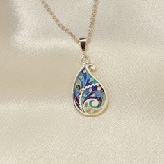 100% handmade sterling silver pendant. Pendant covered with hot cloisonné enamel. Cloisonné  is an ancient technique for decorating metalwork objects with colored material held in place or separated by metal strips or wire, normally of gold or silver. This process is quite laborious, because all the details require hand processing. Georgian cloisonné enamel counts more than 1200 years of history.  Our handmade pendants, earrings, brooches are vibrant with colour and compliment any outfit, prefered for daily wear or a special occasion. Materials: Sterling Silver, Fine Silver, Cloisonne enamel Weight - 2.5 gr (approx) Height - 2 cm; 0.8 inches Width - 1.2 cm; 0.5 inches  About it: Our jewelry pieces are created using a combination of enameling and metal clay techniques. The Cloisonné focal i Traditional Enamel Pendant Jewelry, Sterling Silver Teardrop Jewelry With Artistic Design, Artistic Teardrop Sterling Silver Jewelry, Multicolor Teardrop Enamel Jewelry, Artistic Sterling Silver Teardrop Jewelry, Multicolor Enamel Teardrop Jewelry, Bohemian Enamel Jewelry With Inlay, Bohemian Enamel Inlay Jewelry, Traditional Engraved Enamel Necklaces