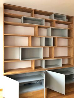 an empty bookcase with several open shelves