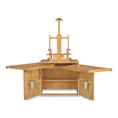 a wooden desk with drawers and an easel on top