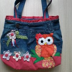 an owl is sitting on the back of a jean purse with flowers and polka dots