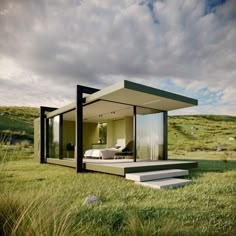 a modern house in the middle of a grassy field