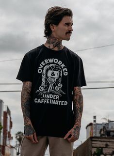 "Overworked Under Caffeinated™", the motto of a generation. The Overworked Under Caffeinated™ unisex crewneck t-shirt is made of high quality and comfy, vintage-inspired garment washed cotton blend fabric. Features: Black Comfy & High-Quality Cotton Blend Fashion-Fit, machine wash. Free Shipping in the US Vans Style Mens, Over Worked, Custom Keyboards, Metal Guys, Masc Fashion, Tattoo Shirt, Dress Better, Free T Shirt Design, Street Fits