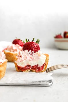 strawberry shortcakes with whipped cream and fresh strawberries on the top are ready to be eaten