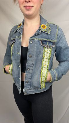 This is a vintage Levi's blue jean jacket size medium.  Hand embroidered with vintage fabric, patches and embroidery. Casual Denim Jacket With Multicolor Embroidery And Pockets, Casual Denim Jacket With Floral Embroidery For Festivals, Retro Outerwear With Embroidered Patch For Spring, Fitted Medium Wash Outerwear For Festival, Cotton Denim Jacket With Multicolor Embroidery And Pockets, Fitted Denim Outerwear For Festival, Casual Floral Embroidered Denim Jacket For Festival, Casual Blue Denim Jacket For Festival, Spring Festival Dark Wash Denim Jacket