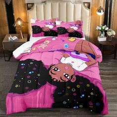 a bed with pink and black comforters on it