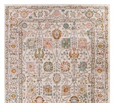 an area rug with various colors and patterns on it, including pinks, oranges,