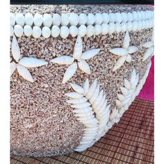 a close up of a bag made out of shells