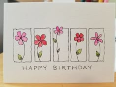 a handmade birthday card with flowers and the words happy birthday written in black ink