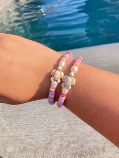 This bracelet is sure to brighten up any outfit! Weather you are going out to dinner on the beach or just hanging with friends, this bracelet is here to bring a pop of color! With the waterproof beads and the sustainable string, this bracelet is fit for any adventure! Pink Beaded Bracelets With Round Beads For Beach Season, Colorful Beaded Friendship Bracelet For Beach Season, Pink Heishi Beads Friendship Bracelets For Vacation, Beach Braided Bracelet With Round Beads And Sliding Knot, Trendy Beaded Strand Friendship Bracelets, Casual Pink Beaded Bracelets For Beach Season, Heishi Beads Stretch Bracelet With Tiny Beads For Beach, Colorful Beads Friendship Bracelet For Beach Season, Multicolor Beaded Strand Bracelets For Beach Party