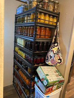 the shelves are filled with many different types of jars and food in containers on them