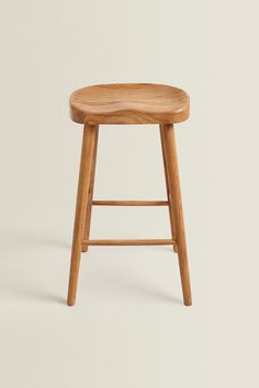 a wooden stool on a white background