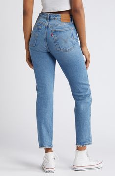 Inspired by cheeky vintage Levi's styles, these low-stretch jeans in a sanded medium wash hug the hips to showcase your curves to greatest effect. Distressed hems add lived-in character to the casual look. 15" leg opening; 11" front rise; 14 1/2" back rise (size 29 x 28) Button fly 99% cotton, 1% elastane Machine wash, tumble dry Imported Levi's Medium Wash Rigid Denim Bottoms, Levi's Straight Everyday Bottoms, Levi's Straight Fit Rigid Denim Bottoms, Levi's Straight Bottoms For Everyday, Levi's Straight Fit Bottoms For Everyday, Fitted Medium Wash Rigid Denim Bottoms, Mid-rise Fitted Rigid Denim Bottoms, Levi's Straight Leg Cropped Jeans In Medium Wash, Levi's Medium Wash Jeans With Five Pockets