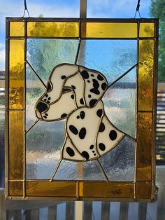 a stained glass window with a dalmatian dog on it