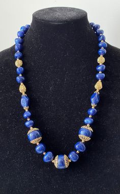 Trifari TM blue plastic, gold plated filigree beaded necklace  Very good to excellent condition  marked: Trifari TM  L - 26.75" with clasp, large beads diameter 7/8"  wt.: 2.9 oz.  04/25/24 1988 Festive Blue Necklaces With Large Beads, Festive Blue Jewelry With Polished Beads, Festive Blue Jewelry With Large Beads, Festive Blue Necklace With Large Beads, Festive Blue Beaded Necklaces With Large Beads, Blue Beaded Necklaces With Large Beads For Festive Occasions, Blue Polished Beaded Necklaces For Festive Occasions, Festive Blue Polished Bead Necklace, Blue Costume Jewelry Necklace With Large Beads