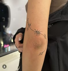 a woman with a tattoo on her arm