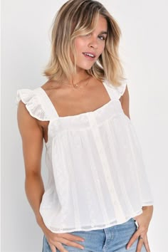 Make all your sunny afternoons a little more adorable with the Lulus Angelic Sweetie White Ruffled Embroidered Button-Front Top! Lightweight woven fabric shapes this adorable top that has eyelet embroidery throughout and wide tank straps with ruffled details. Airy bodice has a full button placket at front and a relaxed fit. Fit: This garment fits true to size. Length: Size medium measures 22.5" from shoulder to hem. Bust: Great for any cup size. Waist: Not Fitted - comfortable room throughout mi White Frilly Tank Top, Cute White Tops Summer, White Tops For Women Simple, White Flowy Beach Top, Cute Tops For School, White Cute Top, Flowy White Top, White Babydoll Top, Cute White Tops