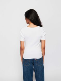 May attract attention. (The good kind.) It's the short sleeve tee you live in, but with a raw hem and a gathered seam down the front. (This one comes in White.) | Women's Nevina Tee Top in White | Ethical Essentials Fitted White Tops For Casual, Fitted White Top For Casual Gatherings, White Fitted Top For Casual Gatherings, Short Sleeve Tops For Casual Gatherings With Relaxed Fit, White Short Sleeve T-shirt For Casual Gatherings, Top Tee, Short Sleeve Tee, The Good, Organic Cotton