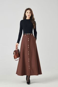 Discover modern elegance in our brown A-line high-waisted wool maxi skirt, thoughtfully designed with button embellishments on the front. The versatile brown shade effortlessly complements various tops. DETAIL * 30% wool, 30% fiber, 40% polyester * Fully satiny liner * Two side pockets * Right zipper closure * Long wool skirt,Maxi skirt * A line skirt,high waist skirt * Formal skirt * Perfect for Winter, autumn * Has belt loops to keep everything in place * Learn More about the items From the FAQs on the page bottom * Dry clean * More color choose No 8: https://etsy.me/4fGTZ6f MODEL SIZE Bust 85 cm(33.4") Waist 67 cm(26.7") Height 168cm (5' 6") She wears size XS Choose CUSTOM Order if you * Need a better fit * Can't find your size in our size Chart * Change the Style * Chang the Length * Y Maxi Long Skirt Outfits, Brown Long Skirt, Edwardian Skirt, Wool Maxi Skirt, Custom Skirt, Long Wool Skirt, Cloak Dress, Button Embellishments, Summer Coats