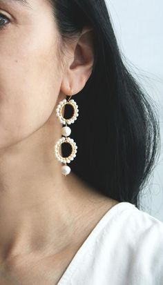 ★★★A modern take on pearls while also keeping it traditional. I've mixed small and large pearls for a unique look. These statement earrings will be a showstopper on your wedding day.+ Freshwater Pearls. 14K Gold Fill Ear Wire. 14K Gold Plate Circles.+ Length: 2.75 inches.+ Earrings take 1 business day to make.+ Your jewelry will come in a jewelry box, tied with a ribbon.➤➤ Have a question about this product, reach out to me here ➙ https://www.etsy.com/conversations/new?with_id=9057464&referr Elegant Teardrop Beaded Earrings For Wedding, Akoya Pearl Round Earrings For Wedding, Pearl White Drop Earrings, Pearl White Pearl Drop Earrings, Pearl Drop Akoya Pearl Earrings For Wedding, Akoya Pearl Dangle Earrings For Wedding, Akoya Pearl Drop Earrings For Wedding, White Pearl Chain Bridal Earrings For Anniversary, White Bridal Earrings With Pearl Chain For Anniversary