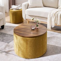 a living room scene with focus on the coffee table and stools in the background