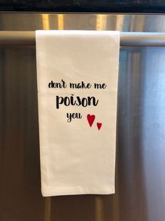 a tea towel hanging on a refrigerator door saying don't make me poison you