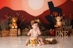 a baby is sitting on the floor in front of some stuffed animals and other toys