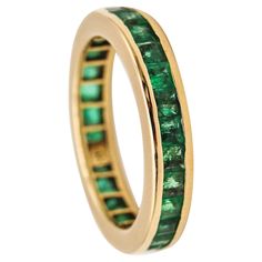 Eternity band with emeralds. Beautiful eternity band ring, crafted in Vicenza Italy in solid yellow gold of 14 karats with high polished finish. Mounted with a great selection of twenty-nine natural green emeralds. Emeralds: Mounted in a channel setting, with 29 Colombian Green Emeralds with a total weight of 2.10 carats. Birthstone: Emerald for the month of May. Weight: 4.25 Grams, (2.73 Dwt.). Size: 7, sizeable. Thickness: 4 mm (0.16 Inch). Hallmarks: Stamped with the mark for the assay of the Green Sapphire Wedding Band, Eternity Band Stack, Eternity Rings Stackable, Vicenza Italy, Emerald Band, Sapphire Wedding Band, Month Of May, Channel Setting, Eternity Band Ring