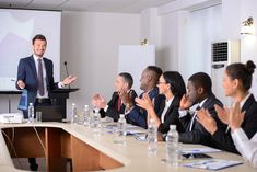 a man giving a presentation to a group of people