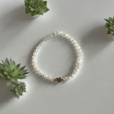 Everyday White Crystal Bracelet With Faceted Beads, White Crystal Bracelet With Heart Beads, White Crystal Bracelet With Heart And Round Beads, White Heart-shaped Adjustable Crystal Bracelet, Elegant White Stretch Bracelet With Heart Beads, Everyday White Beaded Bracelets With Heart Beads, Everyday White Heart-shaped Beaded Bracelets, Adjustable White Pearl Bracelet With Heart Charm, White Stretch Bracelet With Heart Charm And Round Beads