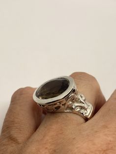 Vintage Smoky Topaz Ring 925 Sterling Silver Unusual Deep Toned Smoky Topaz 925 Sterling Filigree Setting Handmade Size 7.5 can be resized, my jeweler charges $10-$20 All rings are shipped free in the US in a nice gift box. Check out our over a THOUSAND great reviews Engraving is $4 per letter and is not always perfect depending on the piece. It can take a few days if the jeweler is busy. This is payable to Paypal Judithsltd@gmail.com Formal Sterling Silver Jewelry With Large Stone, Sterling Silver Jewelry With Large Stone For Formal Occasions, Classic Round Topaz Ring, Formal Silver Crystal Ring With Polished Finish, Silver Jewelry With Large Stone For Anniversary, Unique Sterling Silver Topaz Ring For Formal Occasions, Silver Jewelry With Large Stone For Formal Events, Silver Jewelry With Large Stone For Formal Occasions, Classic Sterling Silver Faceted Rings