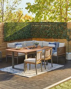 a wooden table sitting on top of a wooden deck