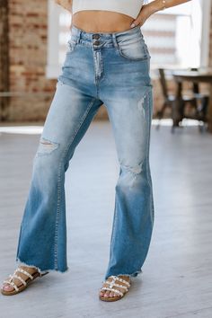 Experience the perfect combination of comfort and style with our Ayah Light Wash Flare Jeans. Made from high-quality denim, these jeans provide a flattering, slimming fit while the flare design adds a touch of trendy flair. Elevate your wardrobe and make a statement with these must-have jeans! Material:75% Cotton + 23% Polyester + 2% Elastane Model info; Models are 5'7", Size 2, wearing smalls Light Wash Flare Jeans, Dusk Blue, The Flare, Jeans Material, Flare Jeans, Must Haves, Size 2, Slim Fit, Models