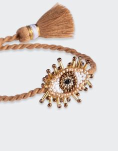 Hand beaded beige Mini Eye Bracelet. Composition: Seed beads, purl wire, leather backing and cotton thread SKU: 2462-0067 Kids Pillows Bed, Hand Embroidered Jewelry, Amulet Bracelet, Indian Crafts, Eye Bracelet, Embroidered Clothes, Evil Eye Bracelet, Women Artisans, Upcycled Vintage