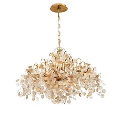 a gold chandelier with many crystal drops hanging from it's center point