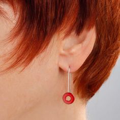 "Luscious bright cherry red glass enamel kiln-fired onto a copper O-ring shape suspended by a slender yet sturdy wire of sterling silver. A charming style that you can dress up or down. These earrings are feather-light! The overall length of the earrings is 1-1/8\" (3 cm). The powdered glass enamel is kiln-fired onto a copper disc 3/8\" (10mm) in diameter. The sterling earwire is hard soldered onto the enameled copper disc. I include a pair of clear rubber earhook \"keepers\" with all earrings, Red Sterling Silver Earrings For Everyday, Modern Red Jewelry For Everyday, Modern Red Everyday Jewelry, Nickel-free Red Earrings For Everyday, Red Nickel-free Earrings For Everyday Wear, Red Hypoallergenic Earrings For Everyday Wear, Minimalist Red Round Earrings, Modern Red Round Earrings, Red Drop Earrings For Everyday Wear