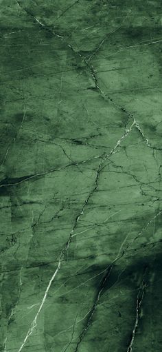 green marble textured with white streaks and cracks