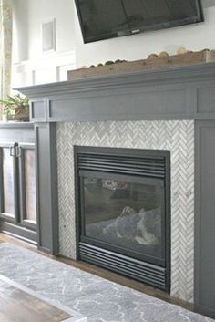 a tv mounted above a fireplace in a living room