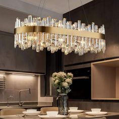 a chandelier hanging over a dining room table