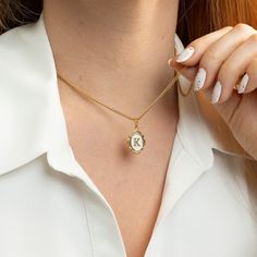 "Oval Initial Necklace  Always carry your loved ones close to your heart ♡ * High-Quality 316L Stainless Steel * Gold Our Products are different from regular gold plating because it is a THICK layer (x10 times more) of 18k solid gold on stainless steel, making it more durable. Size Specs: * Initial Pendant Dimensions: 11mm x 14mm * Necklace will come with a 2\" extension chain so you can FINE TUNE the fit. If you don't want, please contact us. Features: * Waterproof / Hypoallergenic / 100% lead Personalized Oval Gold Necklaces, Personalized Gold Oval Necklace, Personalized Oval Gold Necklace, Personalized Gold Locket Necklace For Mom, Gold Oval Necklace With Initials, White Oval Pendant Necklace With Locket, Oval Charm Necklaces For Gifts, Oval Charm Necklaces As Gift, White Initial Pendant Necklace For Valentine's Day