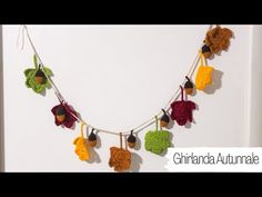 a crocheted garland with leaves and acorns