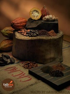 there is a cake with nuts and other things on it that are sitting on the table