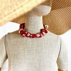 These beads are a two-tone natural Coral in red and white.  The beads are irregular, and the color is best appreciated in person.  The beads are medium size, complimented by two gold color wooden beads.  The necklace makes a statement with its simplicity, showcasing the beauty of the natural cut of the coral.  The natural stone is ideal for daytime, and the shape and design suit nighttime.  The necklace makes it easy to travel with.  The necklace measures 17 inches and weighs 8 ounces. Resin And Clay, Natural Coral, Coral Necklace, The Coral, Unique Necklace, Coral Beads, Gold Heart, Unique Necklaces, Unique Charms