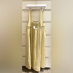 Free People Smocked Midi Dress / Size M / Light Yellow/Crme Color / Nwt Casual Yellow Smocked Dress With Ruched Detail, Casual Yellow Ruched Smocked Dress, Summer Cream Maxi Dress With Smocked Back, Summer Cream Maxi Dress With Smocked Bodice, Cream Maxi Dress With Smocked Back For Summer, Beige Sundress With Smocked Back For Spring, Beige Ruched Maxi Dress For Daywear, Flowy Sundress With Smocked Bodice For Daywear, Beige Dress With Gathered Waist For Daywear