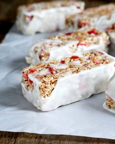 some kind of dessert sitting on top of a white piece of paper with granola toppings