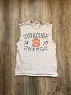 -Size Unisex Medium -Sleeveless Syracuse University shirt Sleeveless Cotton Sports Top, Casual Sleeveless T-shirt With Graphic Print, Casual Sleeveless Graphic Print T-shirt, Stretch Sleeveless Vest With Graphic Print, Stretch Sleeveless T-shirt With Graphic Print, Stretch Cotton Muscle Tee, Casual Sleeveless Tank Top With Graphic Print, Stretch Cotton Muscle Tee Tank, Sleeveless Cotton Tank Top