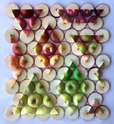 apples and pears arranged in the shape of a triangle