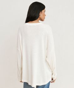 Boyfriend Long-Sleeve Tee Ivory In a luxurious heavy cotton blend, our newest take on a classic tee is a must-have in any transitional wardrobe. Paired with your denim of choice, the oversized silhouette of this boyfriend style tee is comfort at its most elevated. 50% cotton, 50% polyester. Made in Peru. Heavyweight crewneck with an oversized fit and curved hem. Relaxed T-shirt With Shirttail Hem For Fall, Relaxed Fall T-shirt With Shirttail Hem, Relaxed Shirttail Hem T-shirt For Fall, Cozy Drop Shoulder Tops For Everyday, Cozy Drop Shoulder Everyday Top, Fall Relaxed Fit T-shirt With Shirttail Hem, Fall T-shirt With Ribbed Neckline For Everyday, Classic Oversized T-shirt For Spring, Effortless Oversized Top For Layering